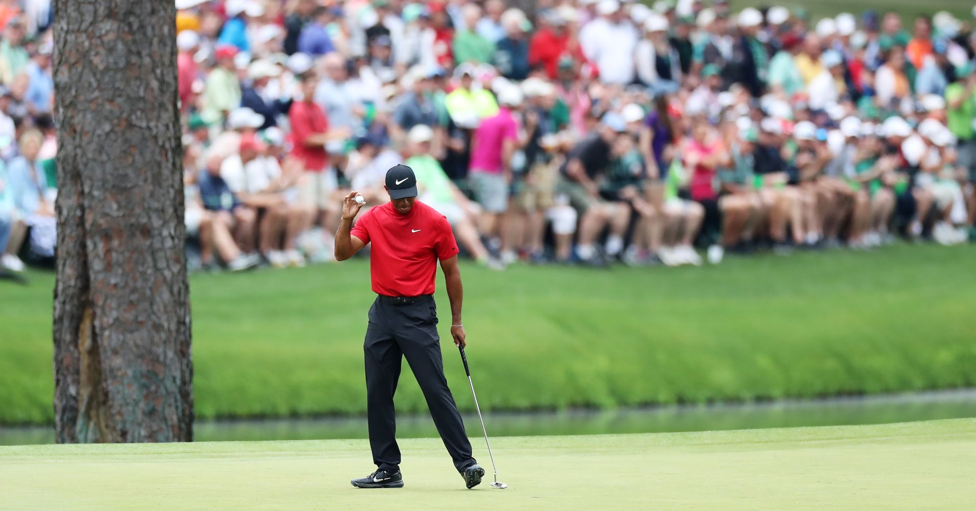 Tiger Woods of the United States reacts on the 15th green during the final round of the Masters at Augusta National Golf Club on April 14, 2019 in Augusta, Georgia.