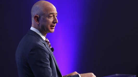 Amazon founder and Washington Post owner Jeff Bezos speaks during the opening ceremony of the media company