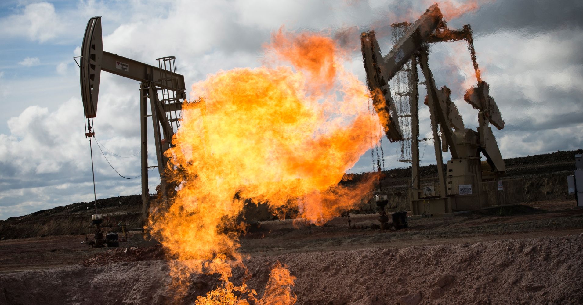 A gas flare is seen at an oil well site on July 26, 2013 outside Williston, North Dakota.