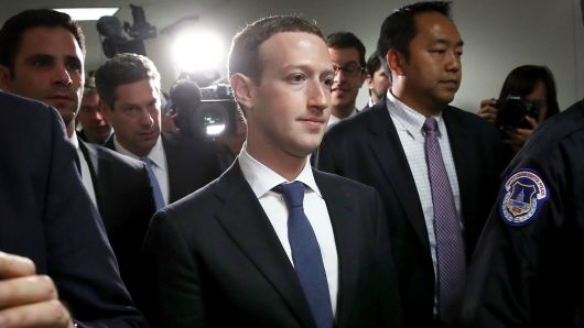 Facebook CEO Mark Zuckerberg (C) leaves the office of Sen. Dianne Feinstein (D-CA) after meeting on Capitol Hill on April 9, 2018 in Washington, DC.