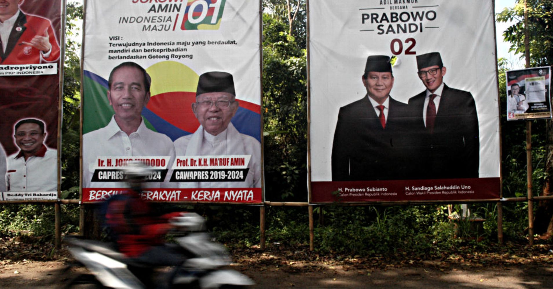 Motorists pass electoral posters in Central Java Province ahead of the presidential and legislative elections. Indonesia is set to hold simultaneous presidential and parliamentary elections on April 17.