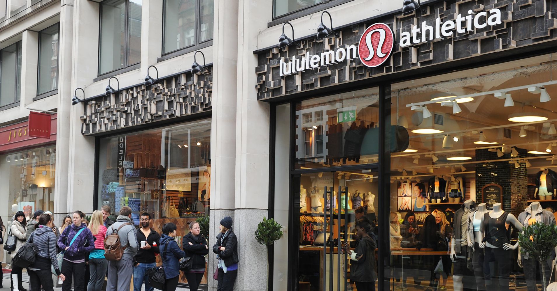 People line up outside a Lululemon Athletica store in London.