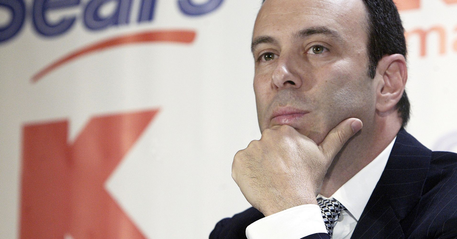 In this Nov. 17, 2004 file photo, Kmart chairman Edward Lampert listens during a news conference to announce the merger of Kmart and Sears in New York.