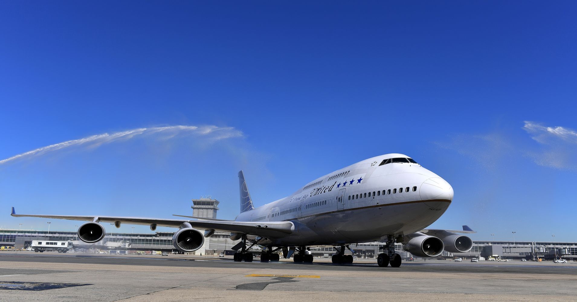 The last United Airlines 747 is greeted by water cannons after it makes its final landing at Dulles International Airport October 19, 2017 in Dulles, VA.