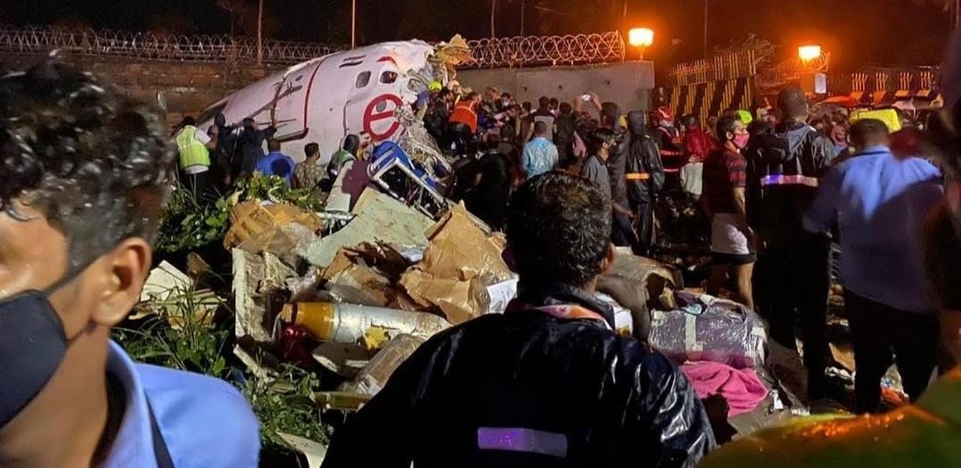 Air India Express plane skids off hilltop runway, cracks, killing 18