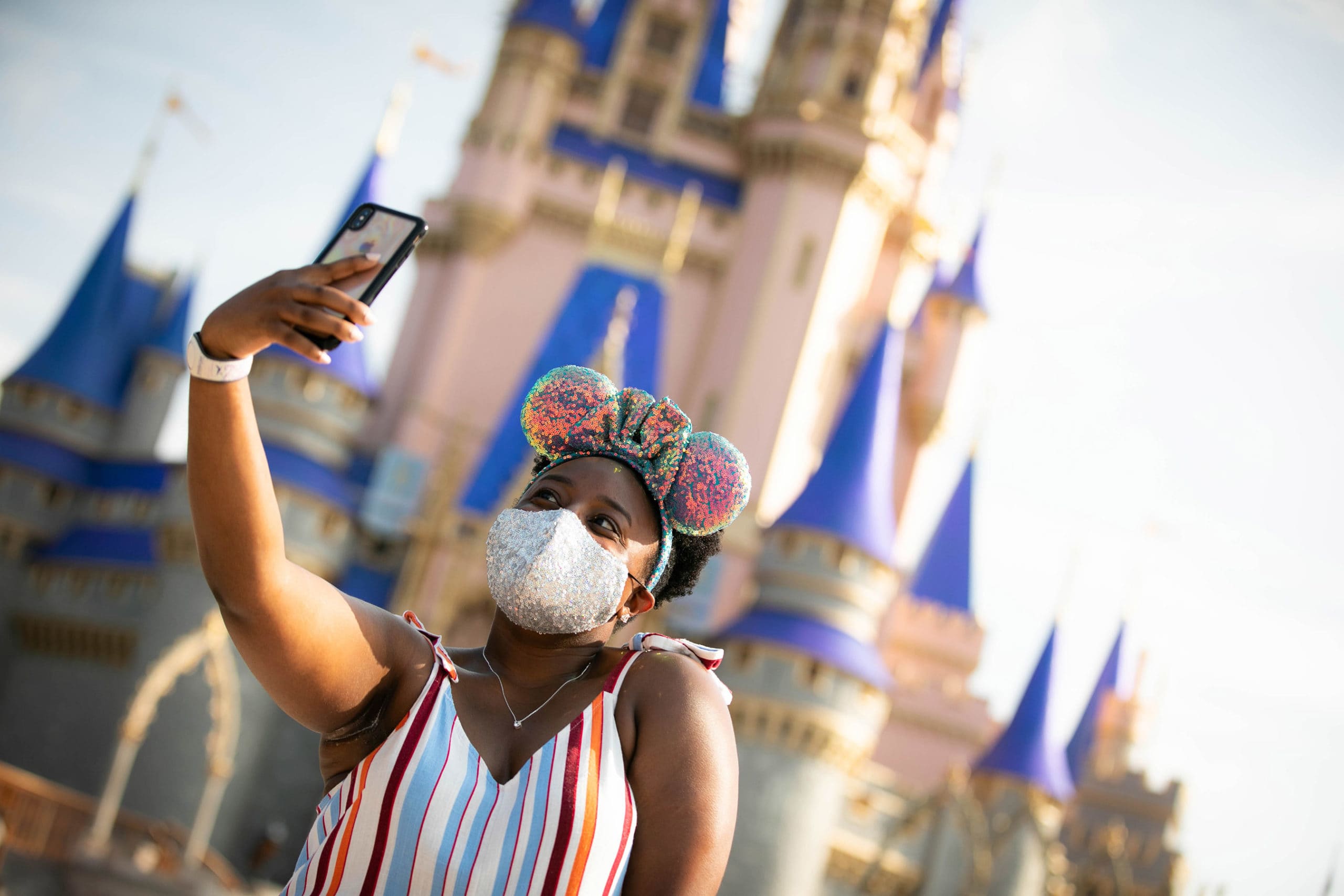 Disney's domestic theme parks will require all parkgoers to wear masks indoors starting Friday