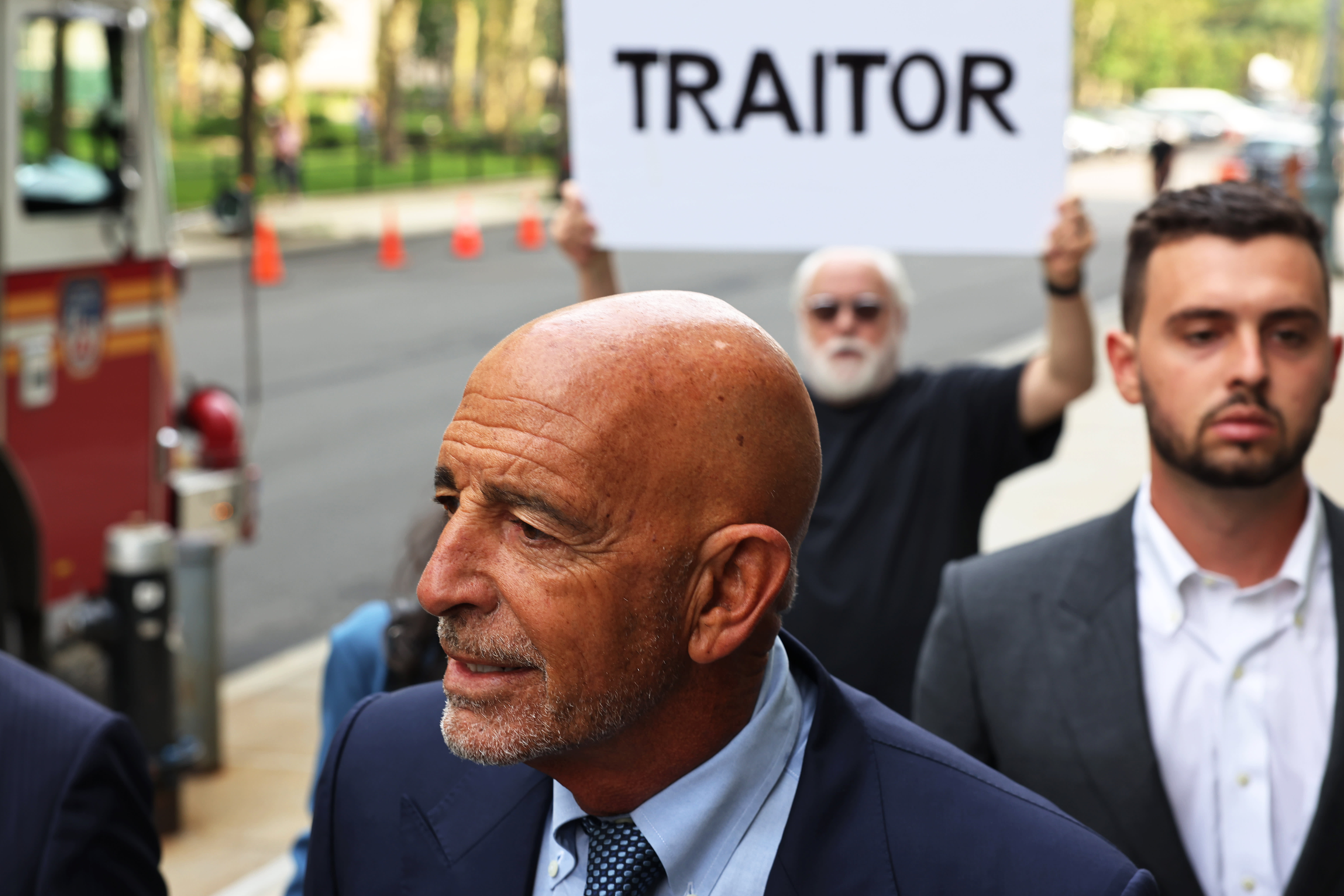 Trump friend Tom Barrack heckled as a 'traitor' as he shows up for arraignment on federal charges